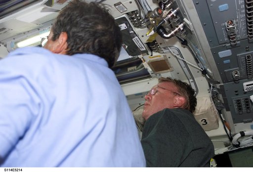 STS-114 Mission specialists Thomas and Camarda on aft flight deck.