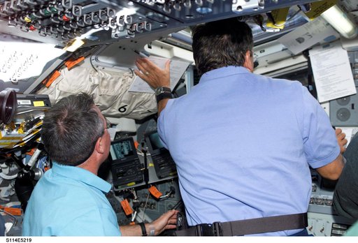 STS-114 Mission specialists Robinson and Camarda on aft flight deck.