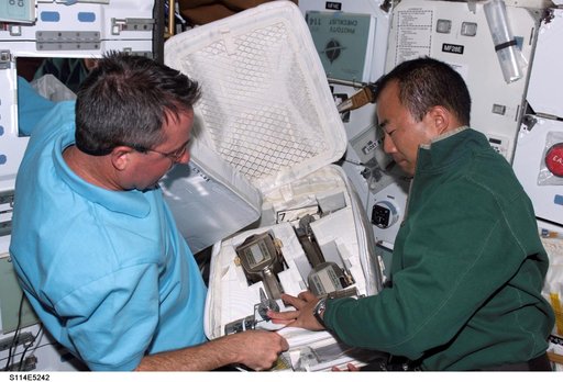 STS-114 Mission specialists Noguchi and Robinson on middeck