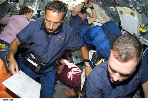 STS-114 crew on flight deck during rendezvous and docking