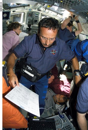STS-114 crew on flight deck during rendezvous and docking