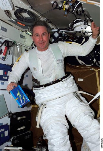 Robinson on middeck with EMU