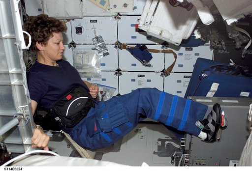 Collins works out on Ergometer on Middeck