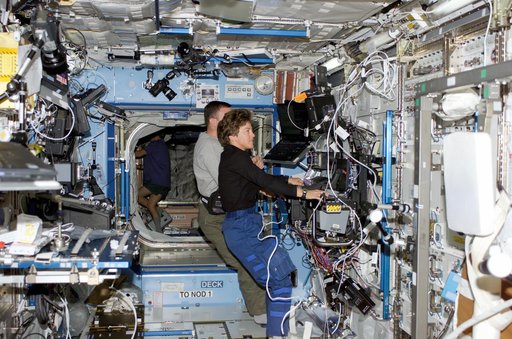 Kelly and Lawrence at SSRMS controls in Destiny laboratory module