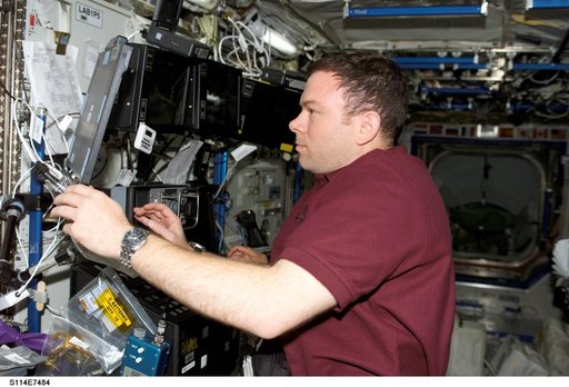 Kelly at SSRMS controls in Destiny laboratory module