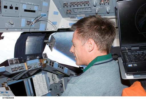 STS-115 Pilot Ferguson on the FD of the Space Shuttle Atlantis as it approaches the ISS