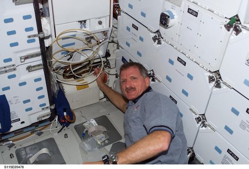 Tanner in the meal preparation area of the FWD MDDK on Space Shuttle Atlantis