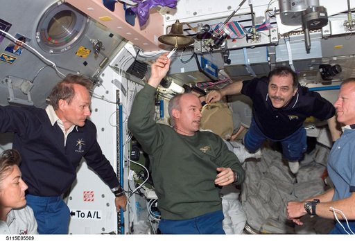 Expedition 13 and STS-115 crewmembers reunite after docking with the ISS