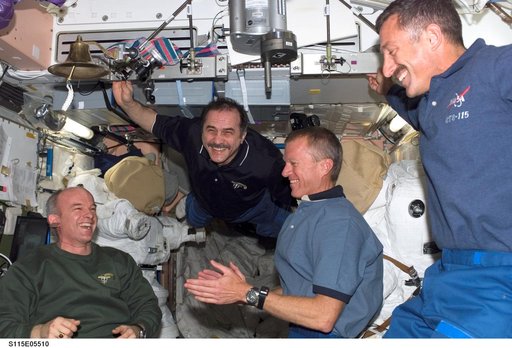 Expedition 13 and STS-115 crewmembers reunite after docking with the ISS