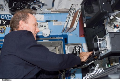 MacLean works at the Robotic Arm in the U.S. Laboratory during STS-115 EVA