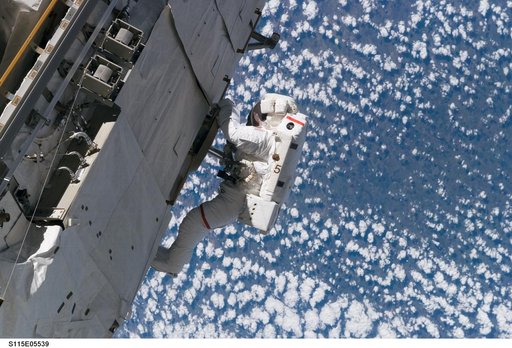 Tanner performs first EVA during STS 115 / Expedition 13 joint operations