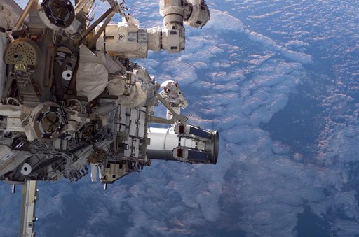 Tanner and Stefanyshyn-Piper performs first EVA during STS 115 / Expedition 13 joint operations