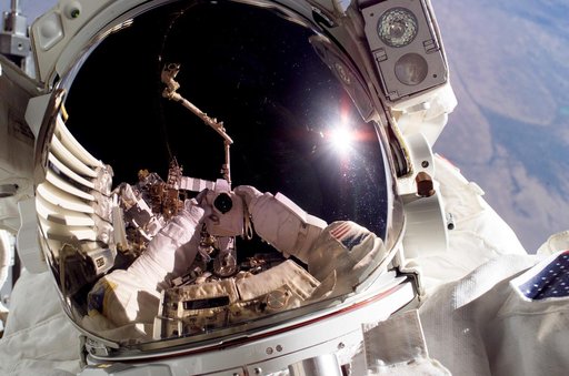 Tanner performs first EVA during STS-115 / Expedition 13 joint operations