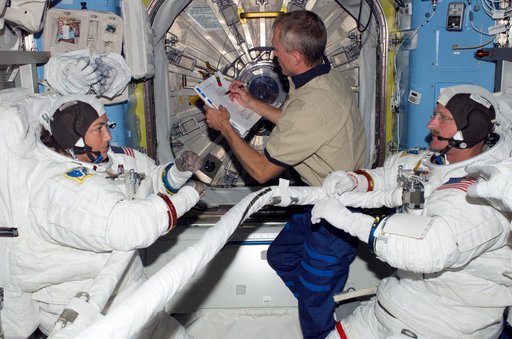 STS-115 MS Stefanyshyn-Piper is wearing her EMU in the Quest A/L on the ISS