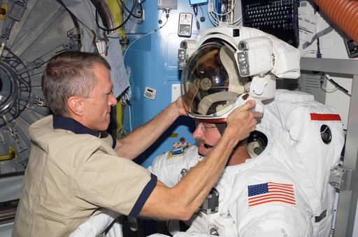 STS-115 MS Stefanyshyn-Piper is wearing her EMU in the Quest Airlock (A/L) of the ISS