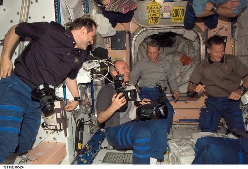 STS-115 and Expedition 13 crewmembers in the Node 1 during Joint Operations