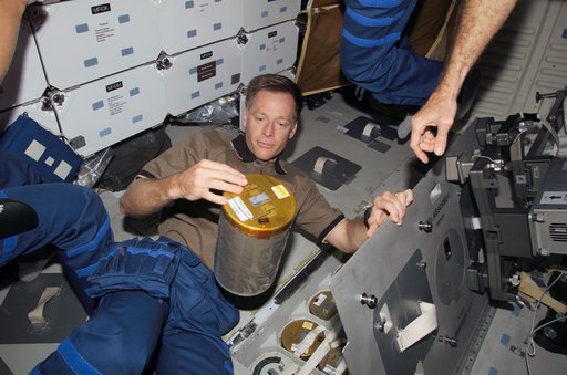 Ferguson changes out lithium hydroxide canister in the Space Shuttle Atlantis MDDK during Expedition 13 / STS-115 Joint Operations