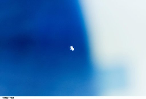 Unidentified small debris taken by STS-115 crewmember