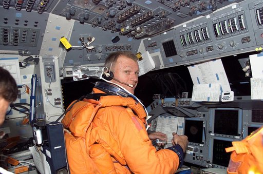 STS-115 Commander looks over checklist in the FD on Space Shuttle Atlantis prior to entry