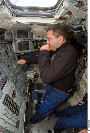 STS-116 MS Patrick works at control panel in the aft FD on Space Shuttle Discovery