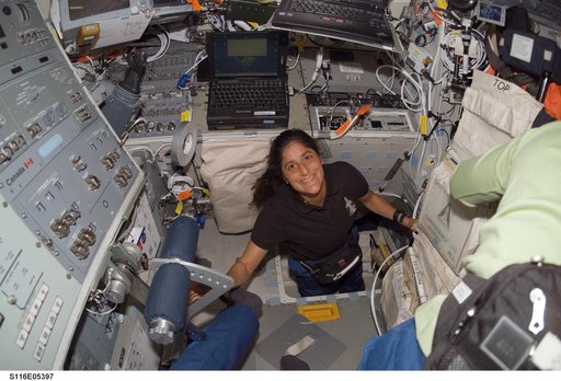 STS-116 MS Williams in the hatch area on Space Shuttle Discovery