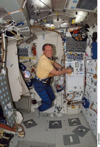 STS-116 MS Fuglesang prepares meal in the FWD MDDK on Space Shuttle Discovery