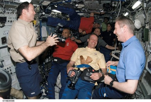 STS-116 Crewmembers in the U.S. Laboratory during Joint Operations