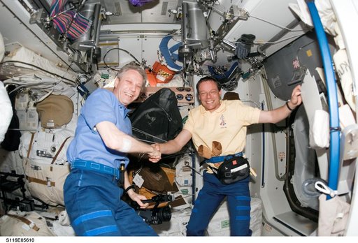 Crewmembers Reiter and Fuglesang in the U.S. Laboratory during Joint Operations