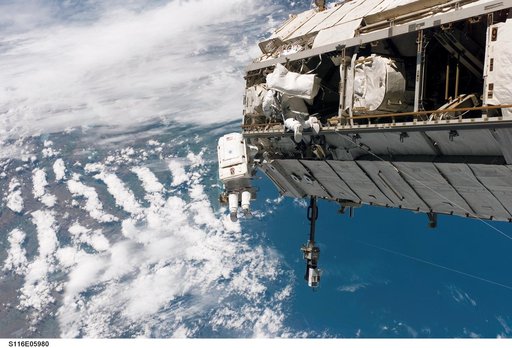 STS-116 MS Curbeam,Jr.,and Fuglesang work on S1 Truss during EVA 1