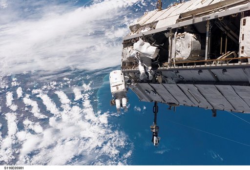 STS-116 MS Curbeam, Jr., and Fuglesang work on S1 Truss during EVA 1