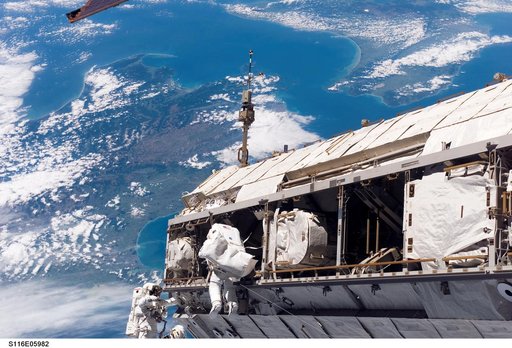 STS-116 MS Curbeam,Jr.,and Fuglesang work on S1 Truss during EVA 1
