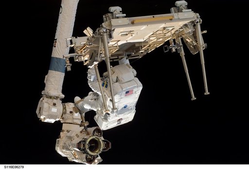 STS-116 MS Fuglesang relocates CETA 2 cart on EVA 2