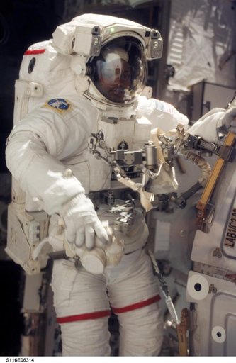 STS-116 MS Curbeam,Jr.,works at the U.S. Laboratory during EVA 2