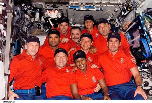 STS-116 and Expedition 14 crewmembers in the U.S. Laboratory