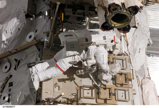 STS-116 MS Curbeam,Jr.,works on CETA Cart during EVA 3