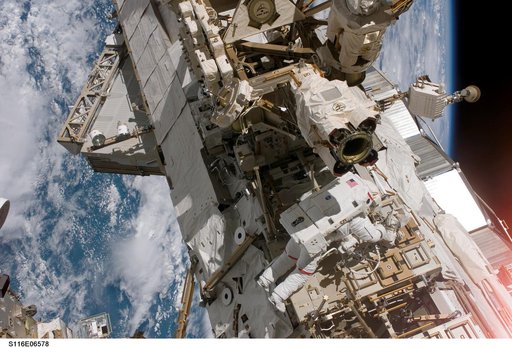 STS-116 MS Curbeam, Jr., works on CETA Cart during EVA 3