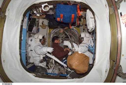 STS-116 MS Fuglesang and Curbeam,Jr.,in the A/L during Joint Operations