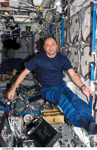 STS-116 Commander Polansky works in the U.S. Laboratory during Joint Operations