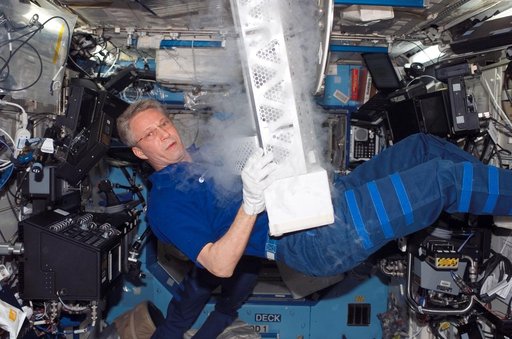 Expedition 14 FE Reiter work on POEMS payload in the U.S. Laboratory during Joint Operations