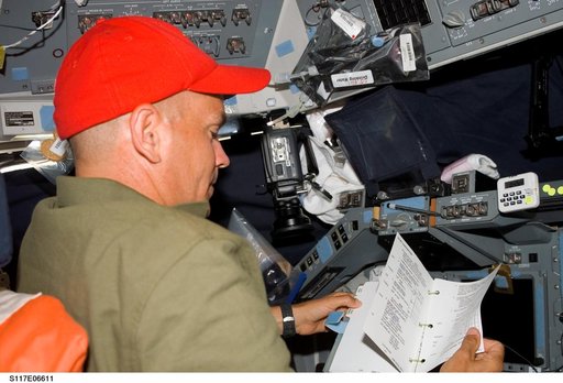 Sturckow looks over procedures on the FD of STS-117 Space Shuttle Atlantis