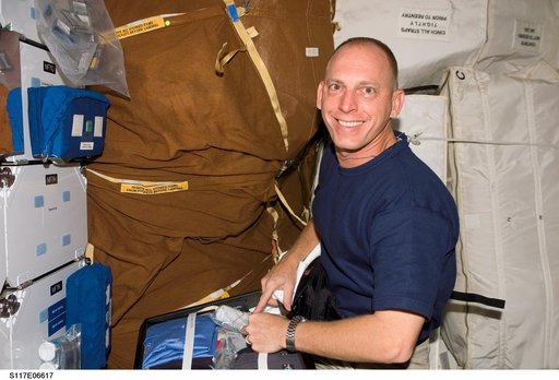 Anderson works with stowage bags on STS-117 Space Shuttle Atlantis