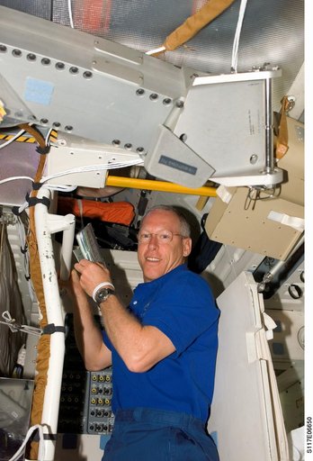 Forrester looks at crew procedures on the MDDK of STS-117 Space Shuttle Atlantis