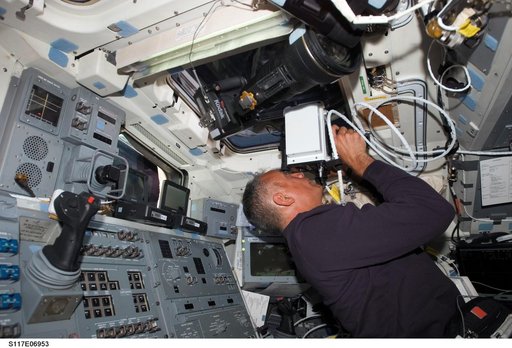 Olivas uses a laser ranging device on STS-117 Space Shuttle Atlantis