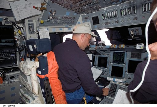 Archambault looks at crew procedures in the FD on STS-117 Space Shuttle Atlantis
