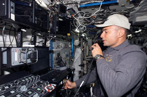 Archambault uses communication equipment in the U.S. Laboratory during Joint Operations