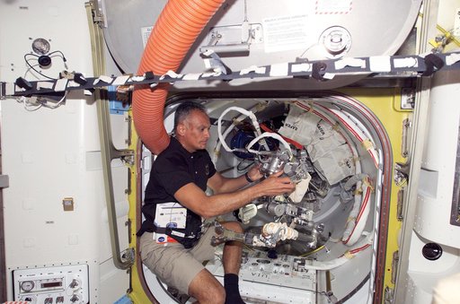 Olivas works with EVA Tether in the A/L during Joint Operations