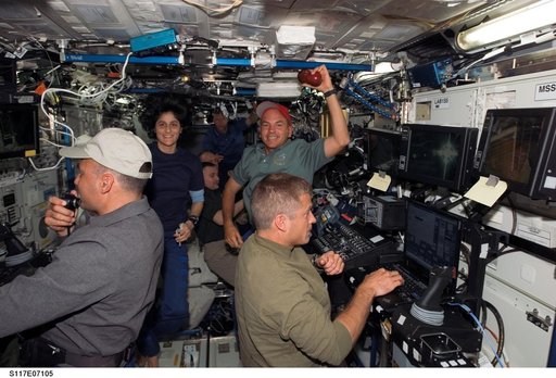 Expedition 15 and STS-117 crewmembers working in the U.S. Laboratory during Joint Operations