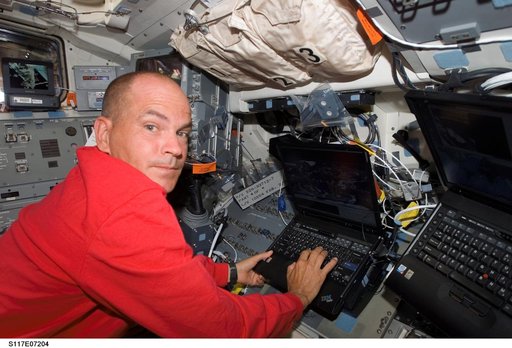 Astronaut Rick Sturckow,STS-117 commander, uses a computer on the FD during Joint Operations