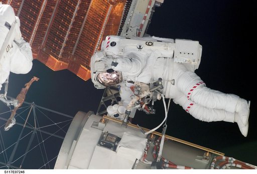 Swanson and Forrester prepare to retract the P6 Truss STBD 2B SAW during EVA 2