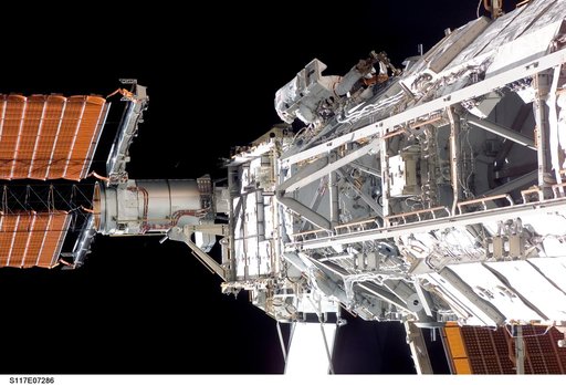 Forrester works at the S3/S4 Trusses during EVA 2 on STS-117 Mission